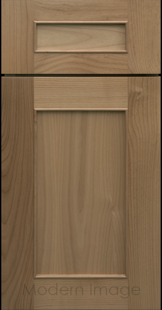 Detail view of a Chandler Shaker cabinet door in Warm Gray stain with raised molding along the inner panel.